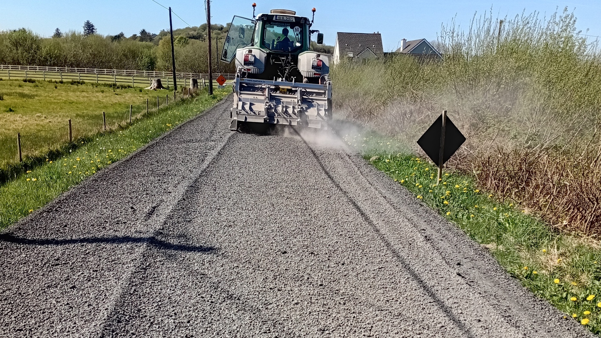 Frosses Road during Roadteam recycling works with tractor processing the surface